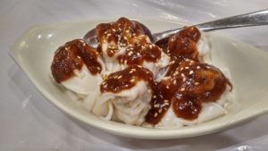 Dumplings in spicy peanut sauce - Oriental Chu Shing