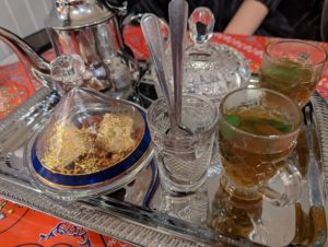 Algerian mint tea, served in ornate glasses on a equally beautiful metal serving platter - Idriss Mediterranean