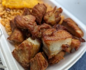 A close-up shot of the griot (fried chunks of pork) Margo Xpress